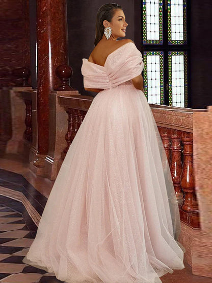 Back view of the A-line off-shoulder prom dress showing pleats and flowing skirt.
