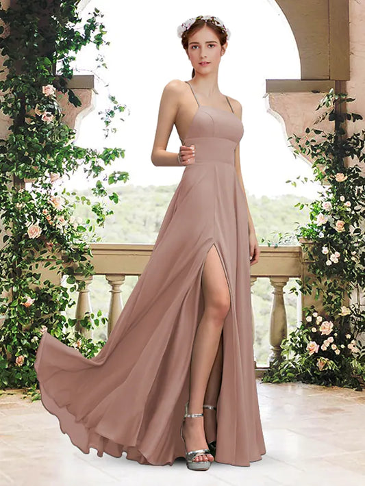 Woman wearing an elegant A-Line bridesmaid dress with square neck and spaghetti straps.