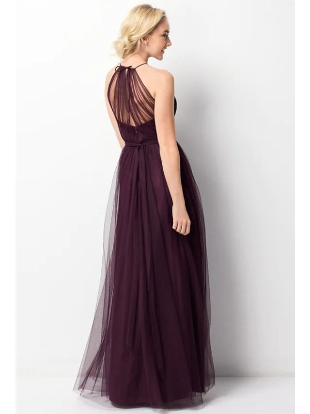 Side view of a model showcasing the flow of the chiffon tulle bridesmaid dress.