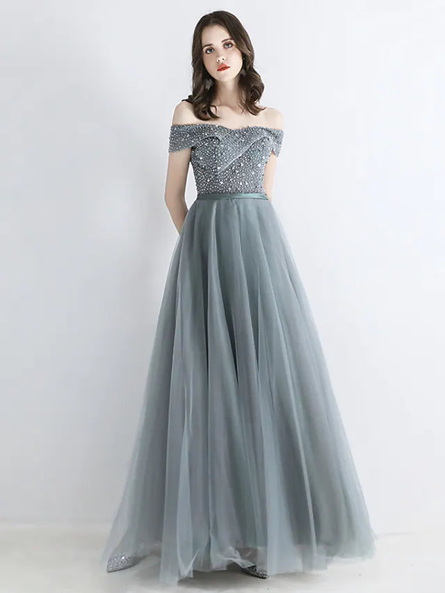 Back view of A-Line chiffon dress with backless detail and crystals.