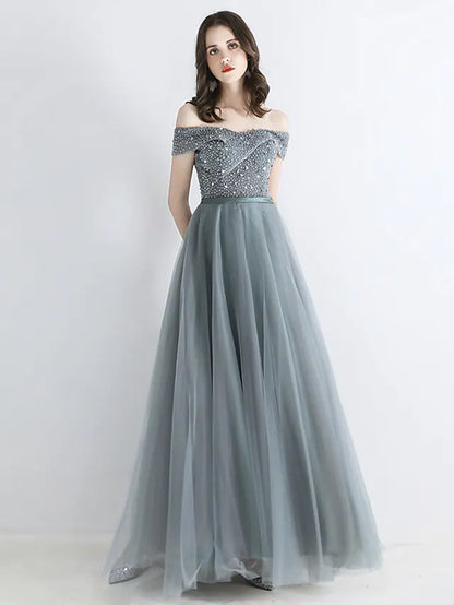 Back view of A-Line chiffon dress with backless detail and crystals.