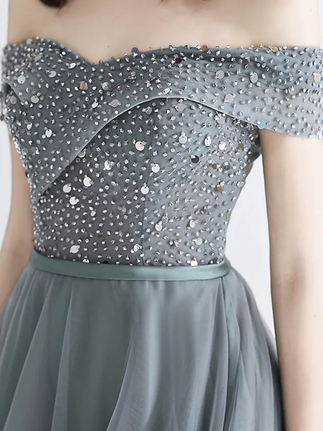 Close-up of illusion neckline and crystal embellishments on dress.