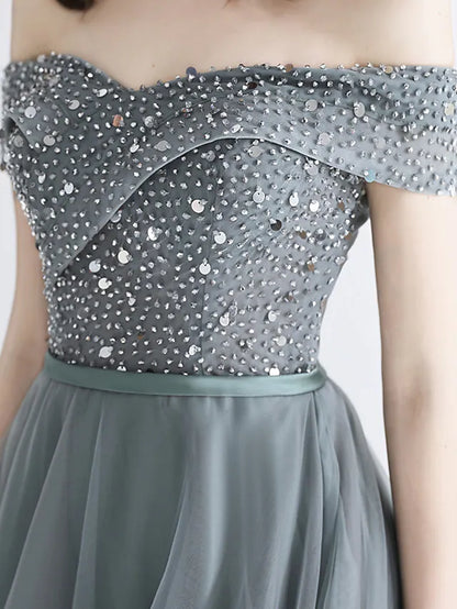 Close-up of illusion neckline and crystal embellishments on dress.