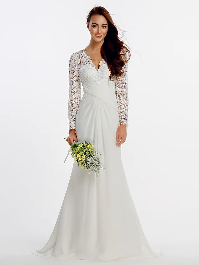 Elegant A-line long sleeve satin beach wedding dress with a jewel neck on a model.