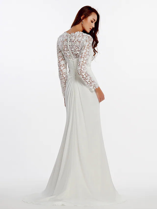 Back view of an A-line long sleeve satin wedding dress with a chapel train.