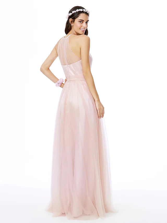 Back view of a pleated tulle bridesmaid gown with a jewel neckline.
