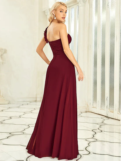 Close-up of the off-shoulder neckline and pleated bodice of the chiffon gown.