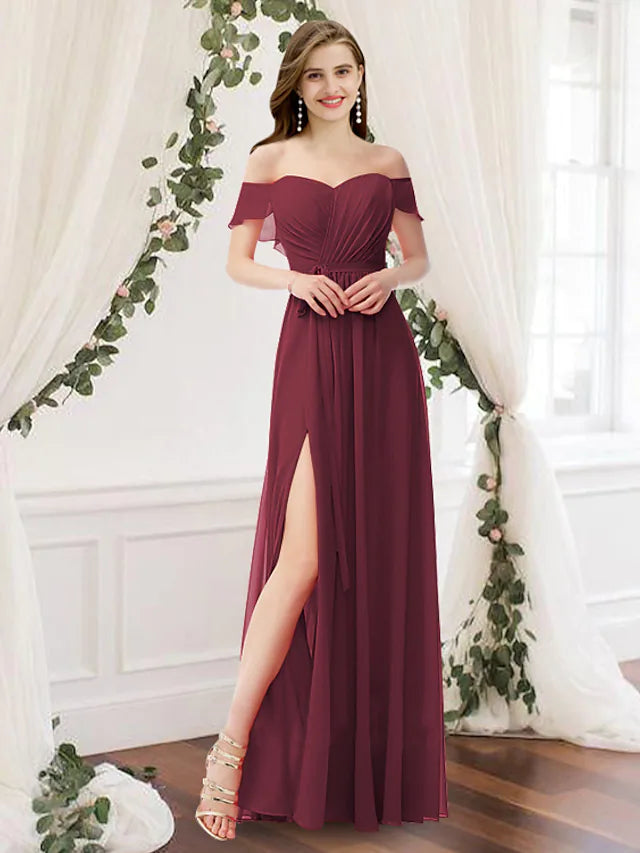 Woman in an elegant light blue A-line off-shoulder bridesmaid dress with pleats.