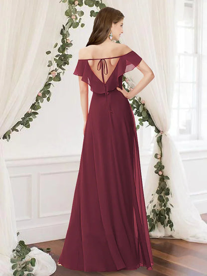 Back view of a woman wearing a light blue A-line off-shoulder bridesmaid dress.