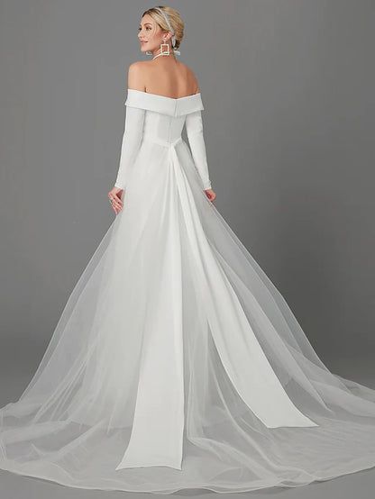 Close-up of the off-shoulder neckline and long sleeves of the chiffon wedding dress.