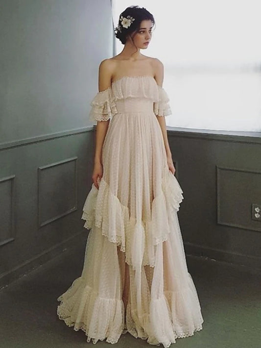 Elegant A-Line off-shoulder lace wedding dress with ruffles, front view.