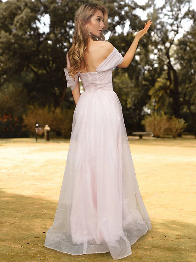 Model wearing a floor-length off-shoulder A-Line gown with short sleeves and pleats.