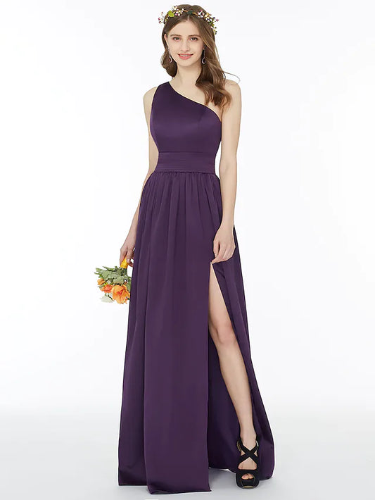 Model in an A-line one-shoulder chiffon bridesmaid dress with a sash and split front.