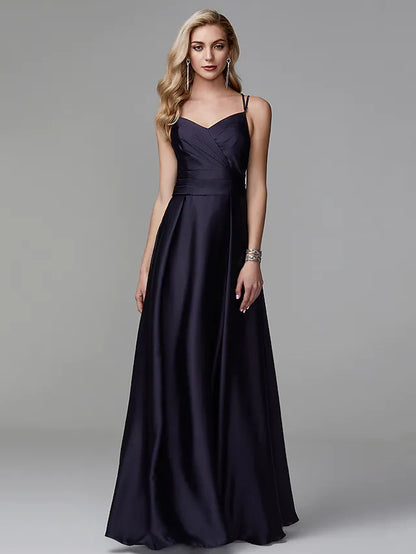 Woman in a light-colored A-line satin gown with a crisscross back.