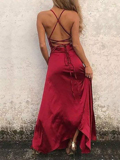 Back view of an A-line satin gown with spaghetti straps and beautiful back design.