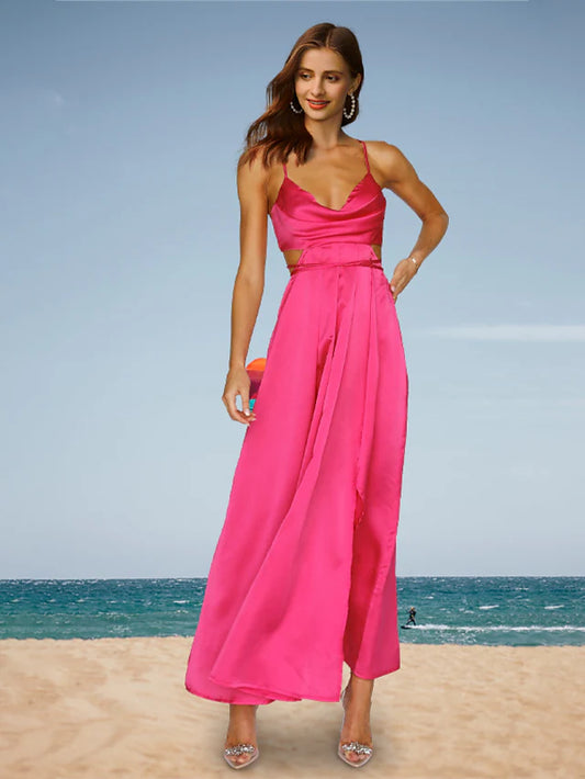 Woman wearing a minimalist charmeuse prom dress with spaghetti straps and a backless design, front view.