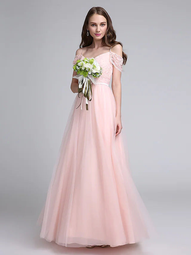 Woman wearing an elegant A-Line spaghetti strap bridesmaid dress.