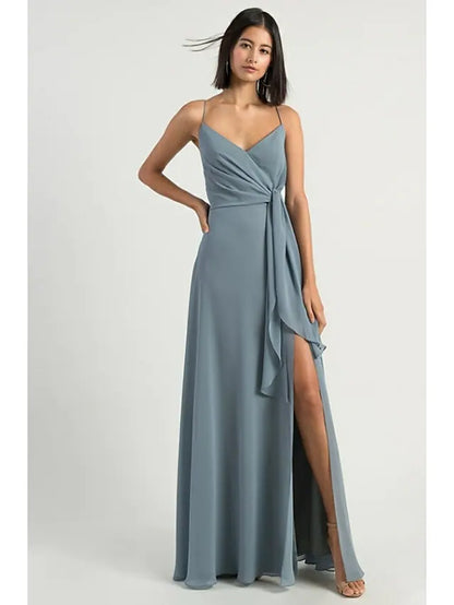 Model wearing an elegant A-line spaghetti strap bridesmaid dress with an open back.