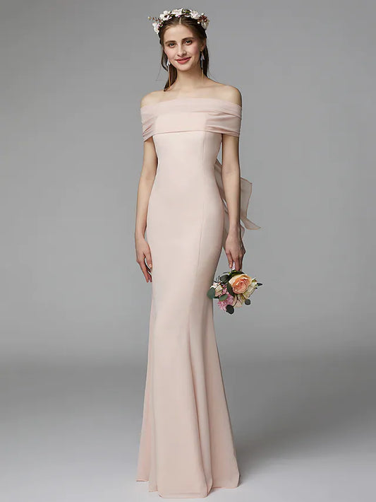 Front view of an elegant strapless backless chiffon bridesmaid dress with a sash and pleats.