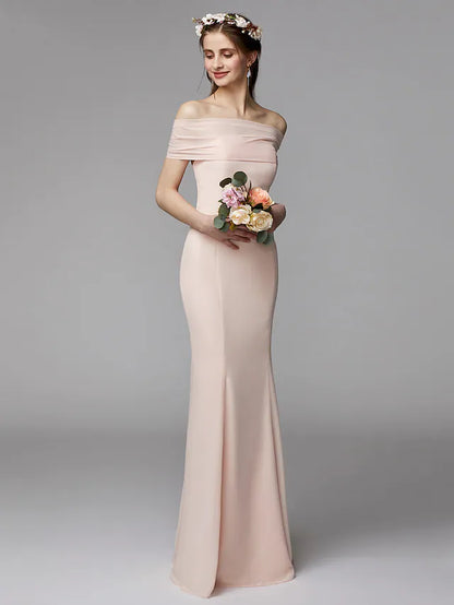 Side view of a flowing strapless chiffon bridesmaid dress with a sash and pleats.