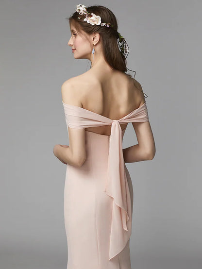 Close-up of the delicate pleats and sash ribbon detail on the chiffon bridesmaid dress.