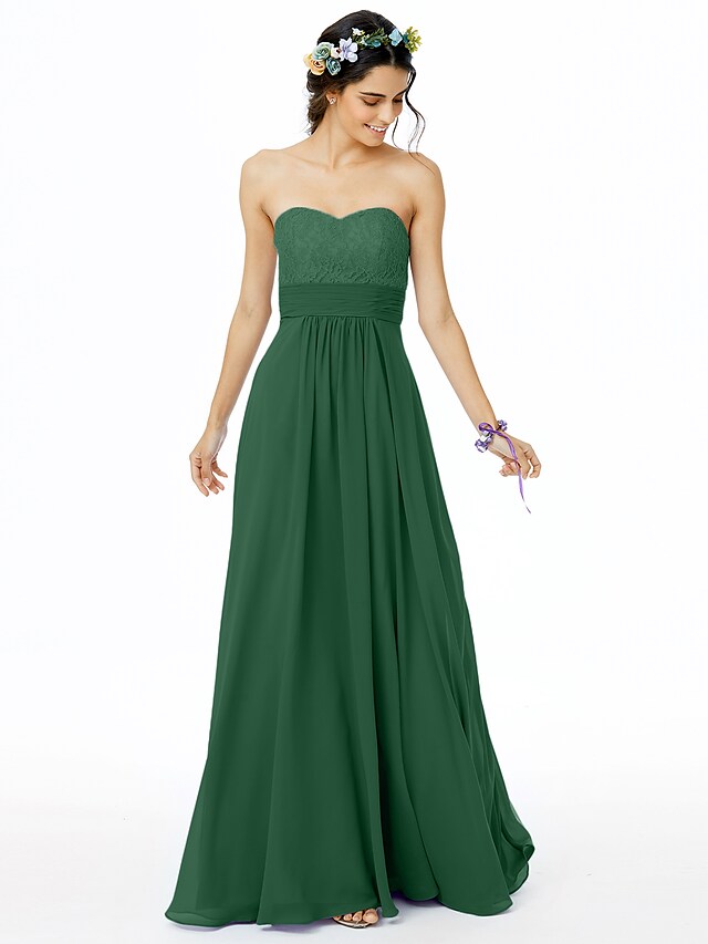 Back view of an elegant bridesmaid dress showcasing an open back and lace accents.
