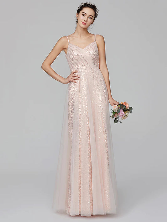 Model wearing an A-line spaghetti strap sequined tulle bridesmaid dress, front view.