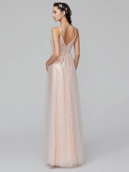 Model wearing an A-line spaghetti strap sequined tulle bridesmaid dress, back view.