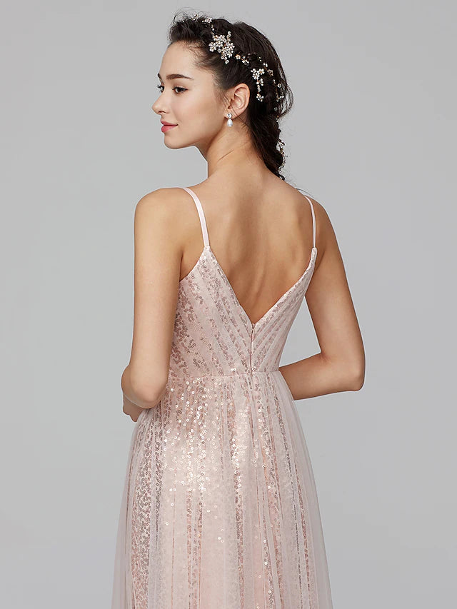 Close-up of the sequined and pleated bodice of the A-line dress.