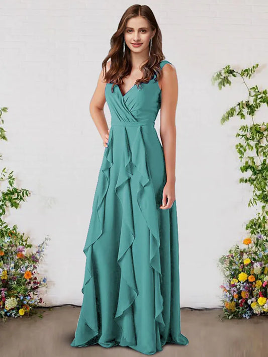 Woman wearing an elegant light-colored A-Line V-Neck chiffon bridesmaid dress with ruffles.