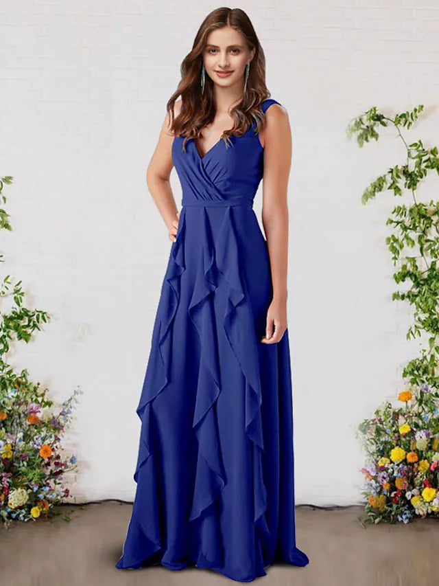 Side view of a woman in a floor-length A-Line V-Neck chiffon dress with ruffle details.
