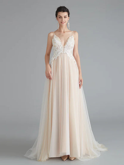 Model wearing an elegant A-line V-neck lace prom dress with beading.