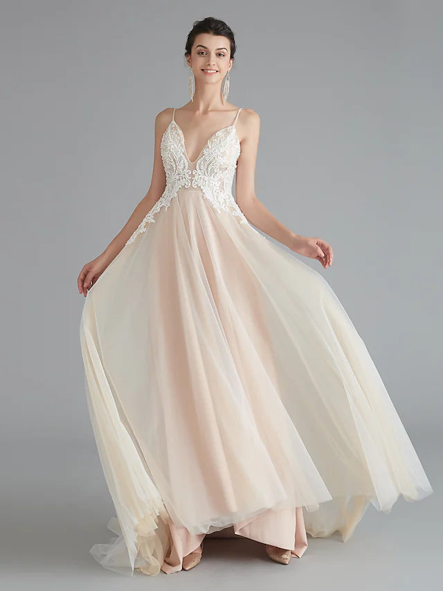 Back view of the A-line prom dress showing sweep train and lace details.