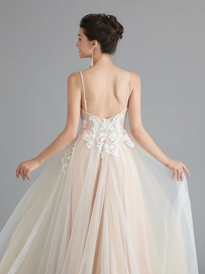 Close-up of the V-neckline and beaded lace on the dress.
