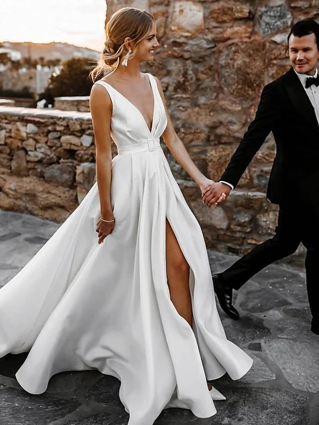 Side profile of the A-Line V-neck open back satin wedding dress, showcasing the court train.