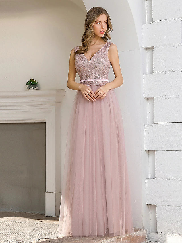 Model wearing an elegant A-line V-neck satin evening gown with a sequin sash, front view.