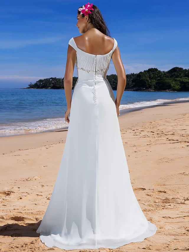 Side profile of the chiffon wedding dress, showing beading details on the bodice.