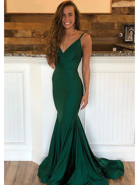 Elegant champagne satin prom gown with sweetheart neckline and pleated bodice.