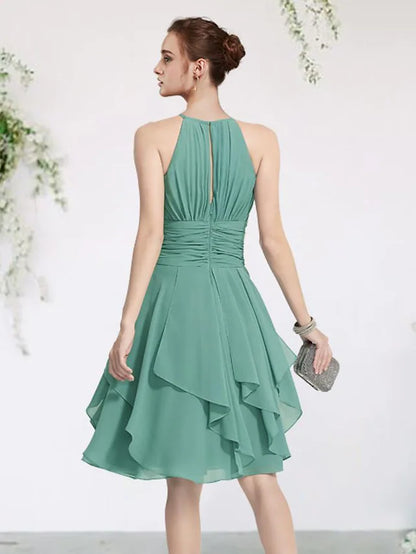 Bridesmaid dress with jewel neck, sleeveless design, and cascading ruffles on a model in a different pose.