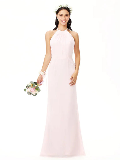 Back view of a woman in a floor-length pleated chiffon bridesmaid dress.