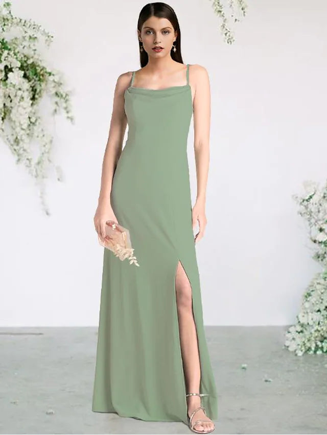 Woman wearing a floor-length chiffon bridesmaid dress with spaghetti straps and a split front.