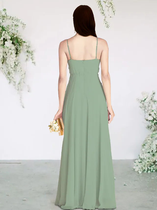 Back view of a woman in a sleeveless chiffon bridesmaid dress.