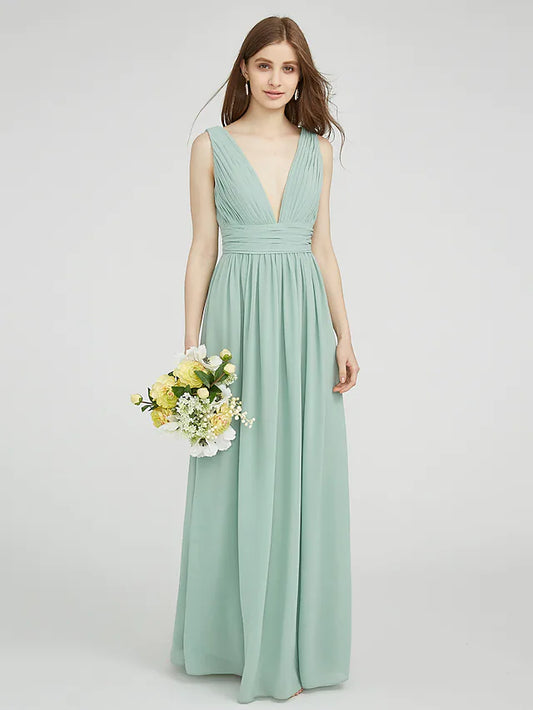 Model wearing an elegant V-neck chiffon bridesmaid dress with ruched side draping.