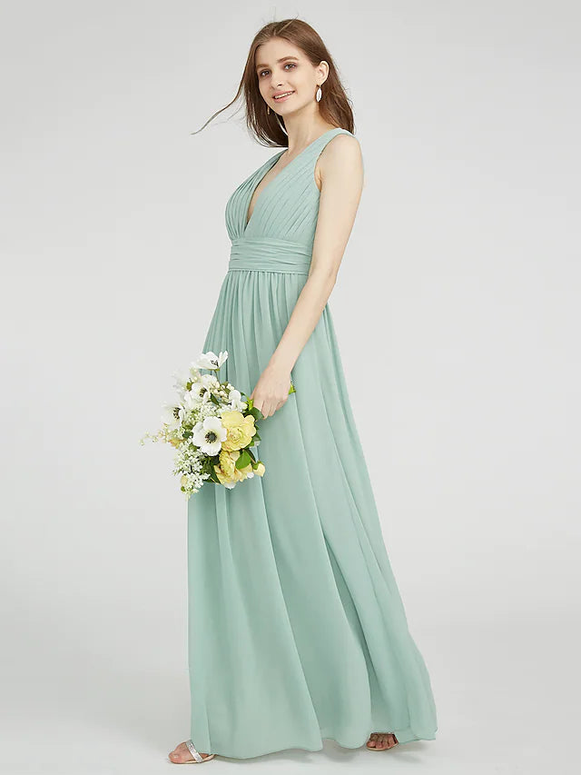 Side view of a model showcasing the ruched detailing on a chiffon bridesmaid dress.