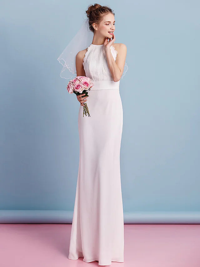 Back view of a bride wearing a sleeveless lace and chiffon wedding gown.