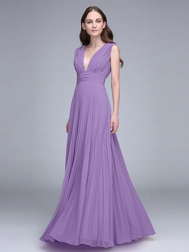 Woman in an elegant V-neck floor-length chiffon bridesmaid dress, posing gracefully.