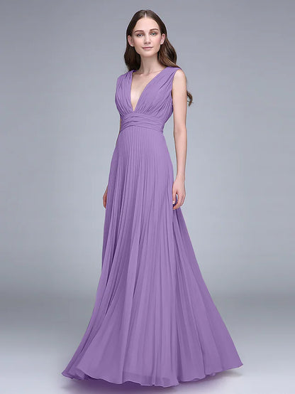 Woman in an elegant V-neck floor-length chiffon bridesmaid dress, posing gracefully.