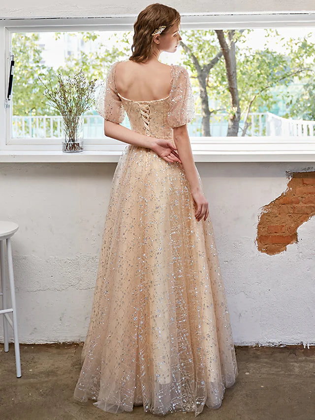 A-Line glittering prom dress with short sleeves, side view.