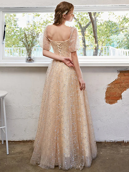 A-Line glittering prom dress with short sleeves, side view.