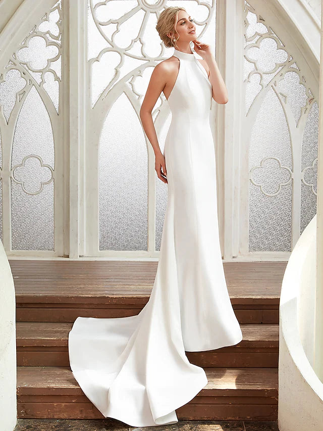 Full length view of the elegant satin pleated wedding gown.